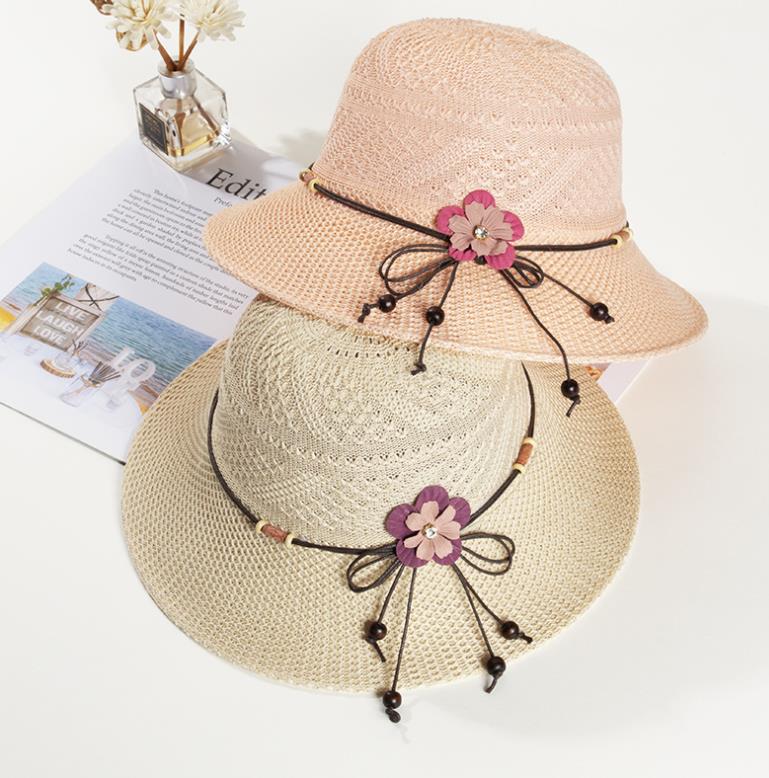 帽子の女性夏季2021新型漁師の帽子のひもの花の日よけ帽子は空気を通して帽子の女性を折り畳むことができます。